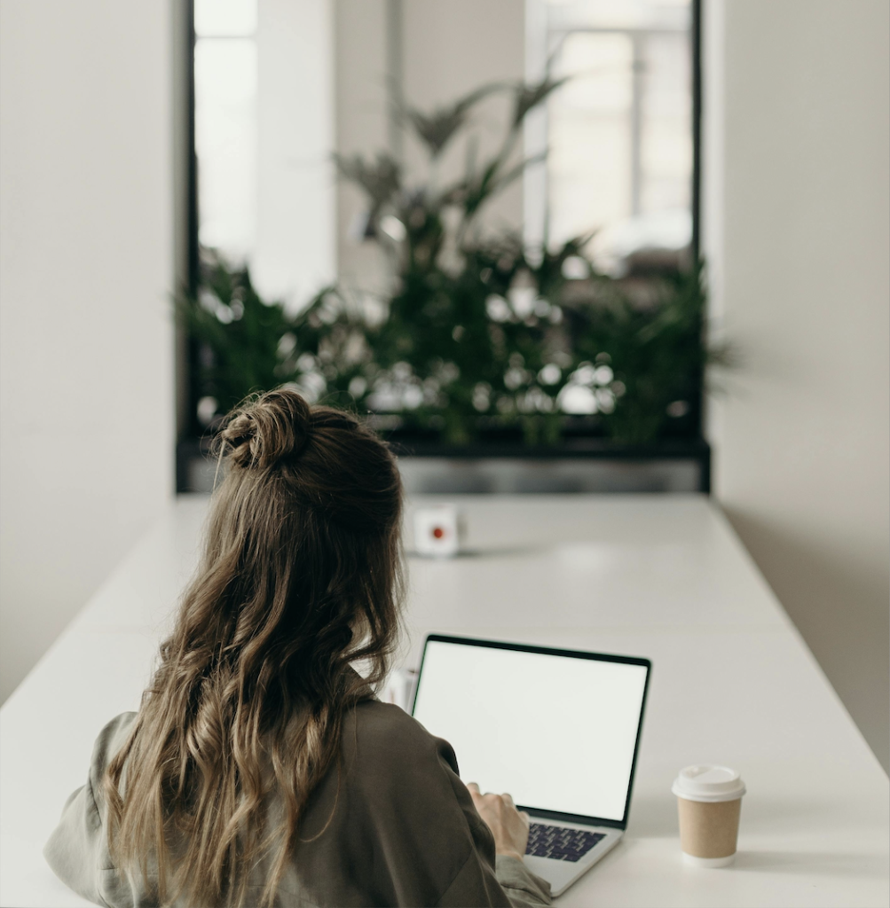 Remote professional working on a laptop in a flexible workspace