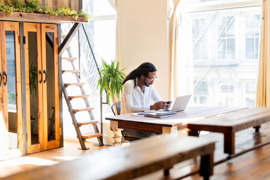Professional working from The Farm Soho, an eOffice eNetwork partner workspace in New York City during the FIFA World Cup Finals.
