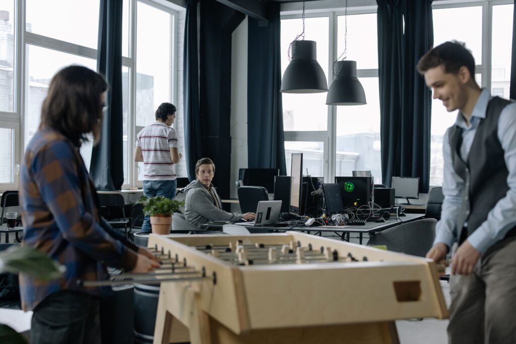 Professionals enjoying breakout spaces in a modern coworking environment