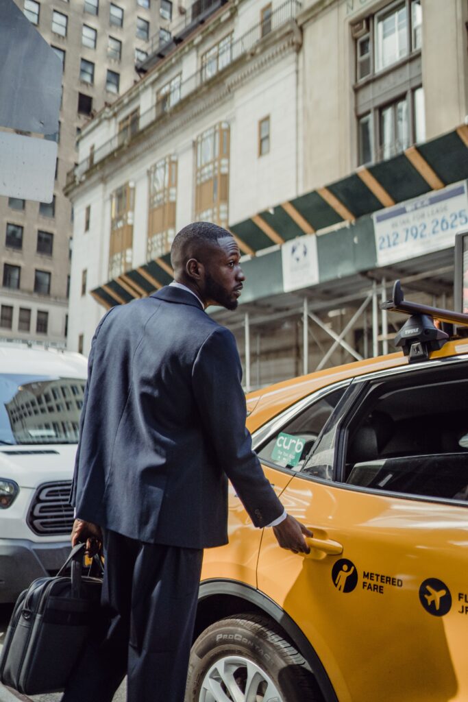 Business traveller taking a taxi in New York