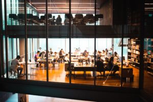 Professionals working in a busy modern coworking space