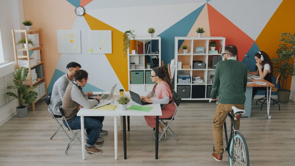 Professionals collaborating and working independently in a modern coworking space